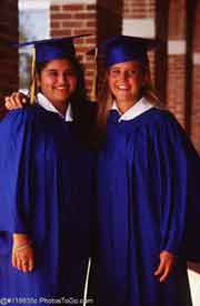 Two women in graduation gowns; Size=180 pixels wide